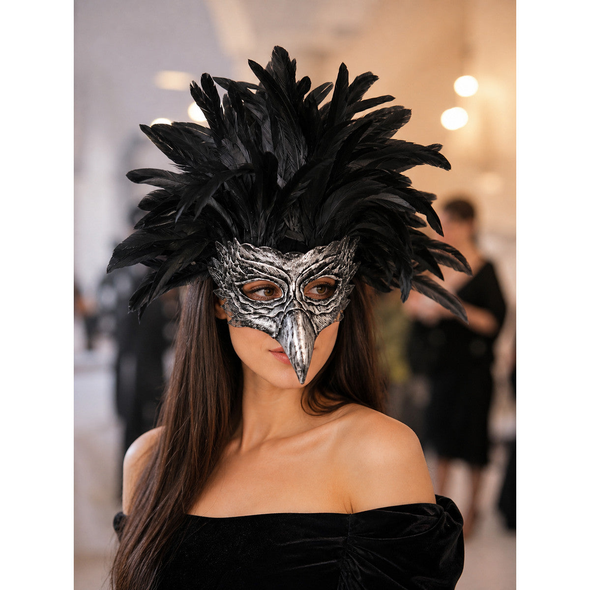 Woman wearing the black feather eagle mask with a black off-shoulder dress at an evening party