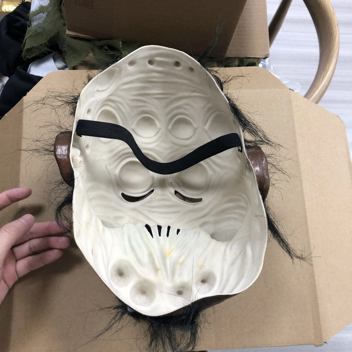 Inside of the spider half face mask showing the open back and black strap