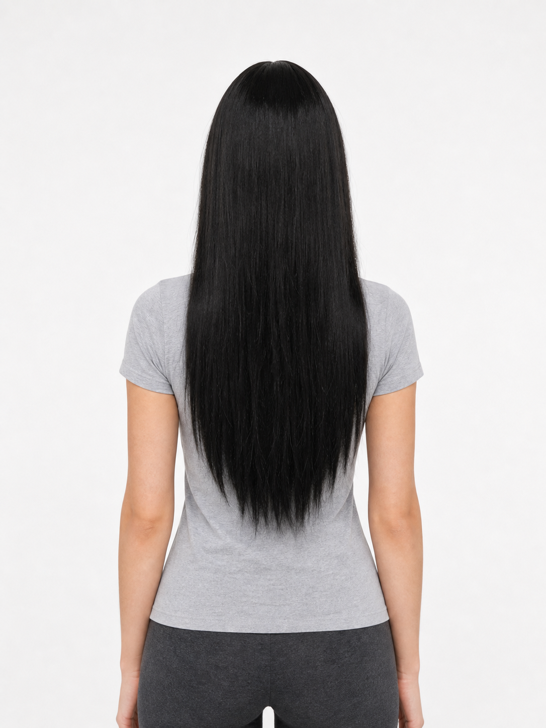 Black straight wig shown from the back on a model, with long hair falling below the shoulders