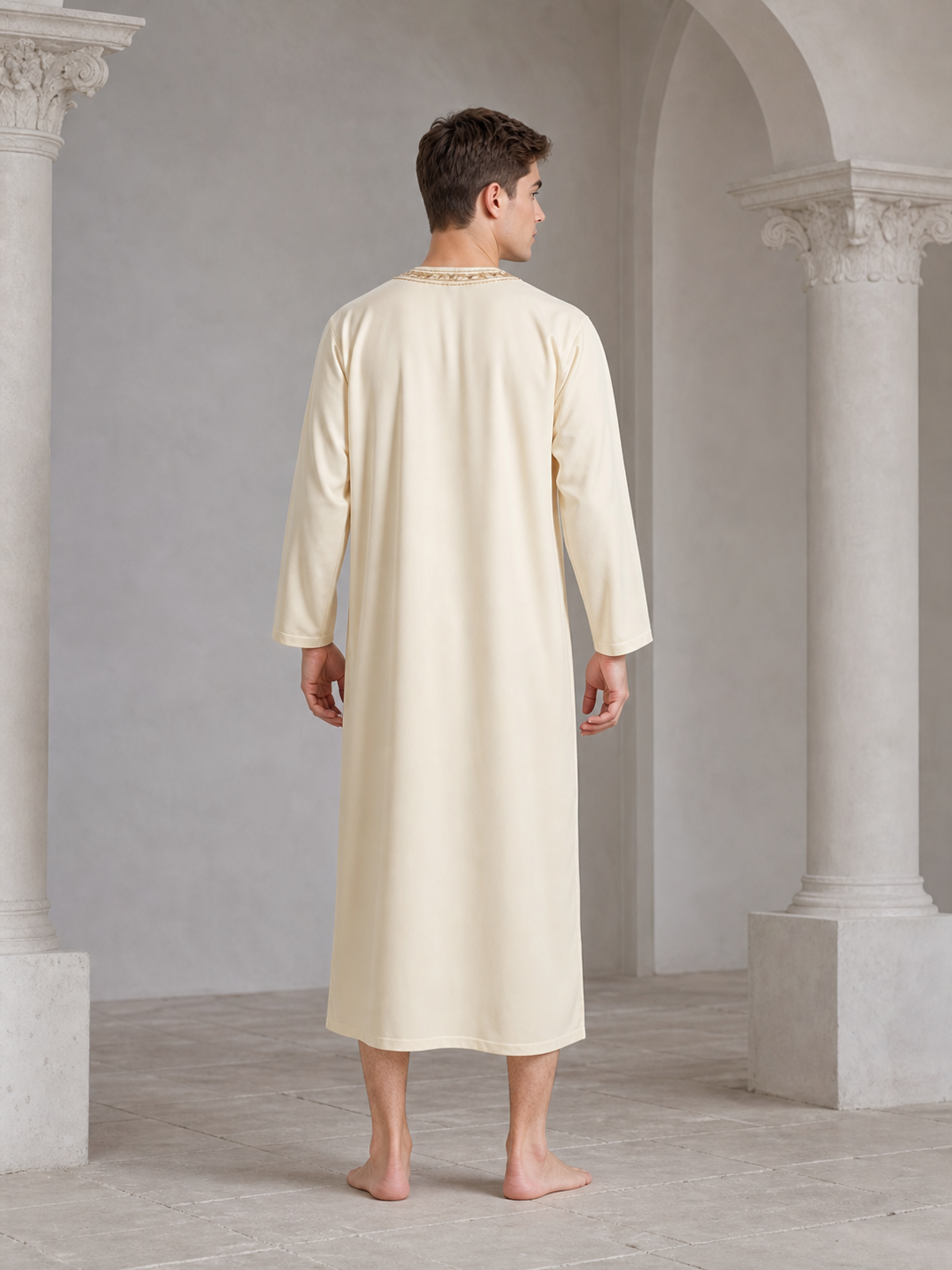 Cream long tunic robe shown from the back on a barefoot model, with long sleeves and embroidered trim visible around the neckline