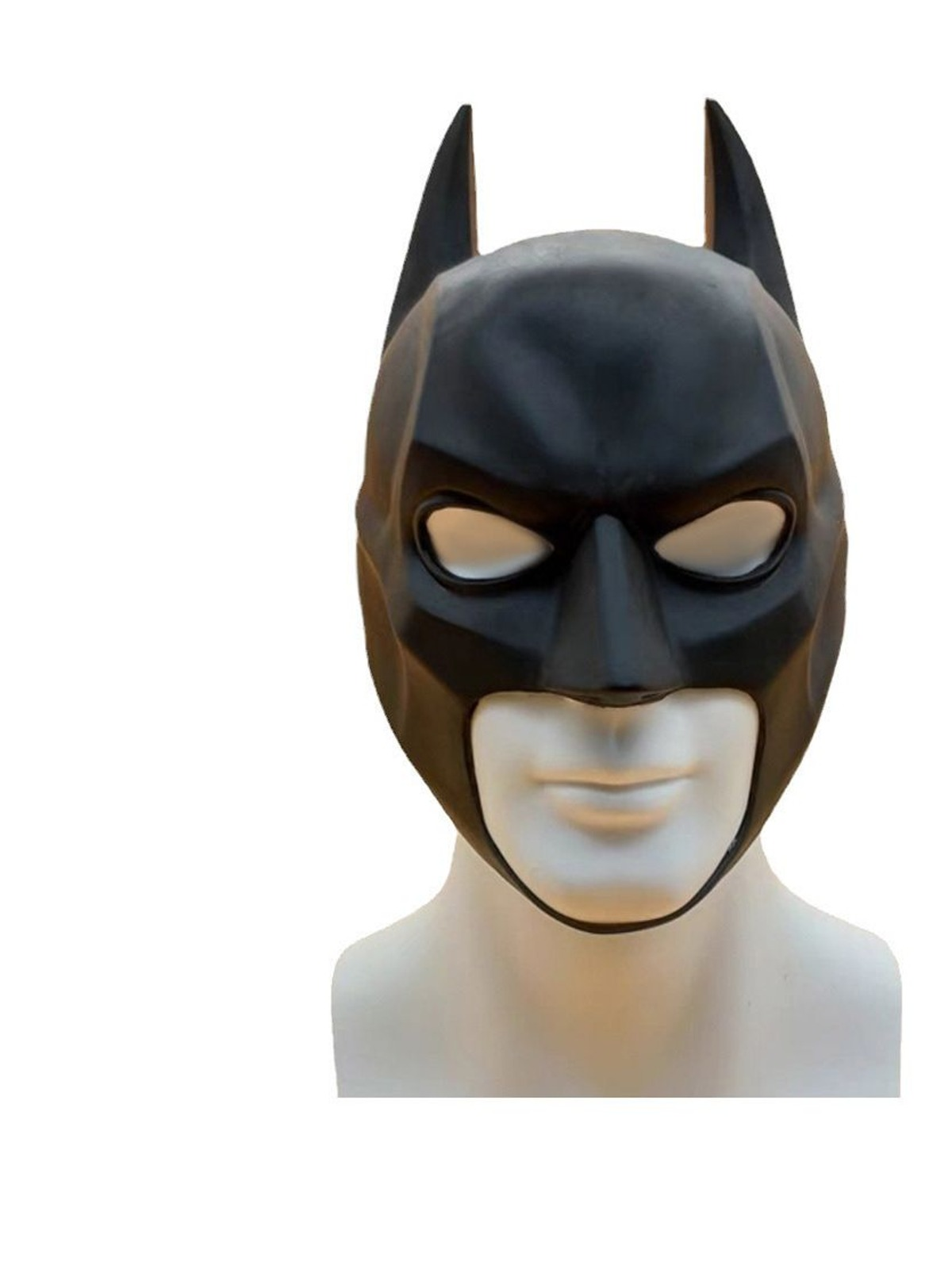 Close-up of the black latex bat hood mask on a display head, showing the sculpted brow, eye openings and open lower face