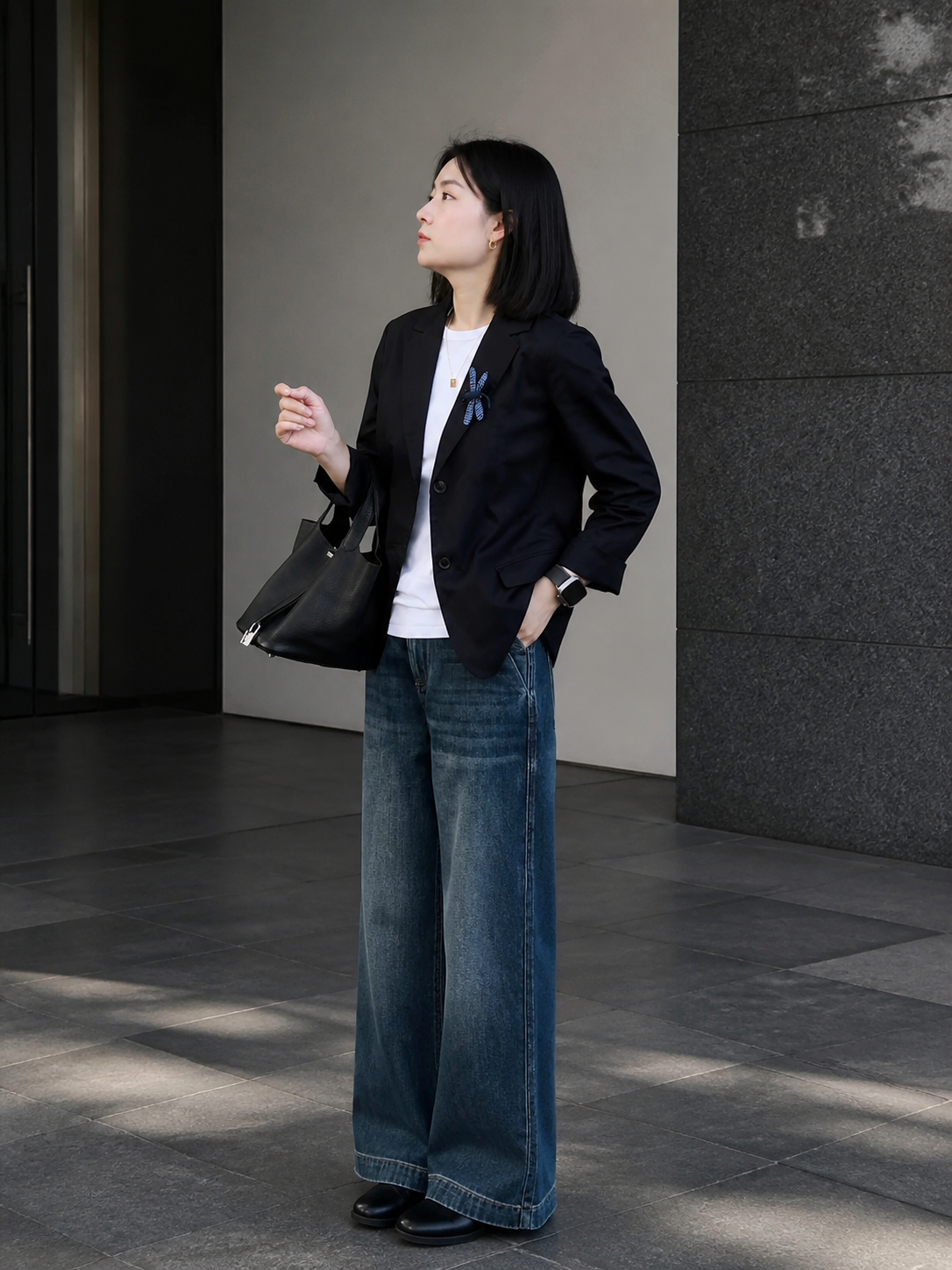 Women's black blazer with lapels and a tailored fit