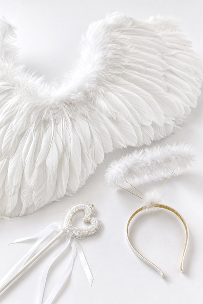 White angel wings with feathers, headband, and wand