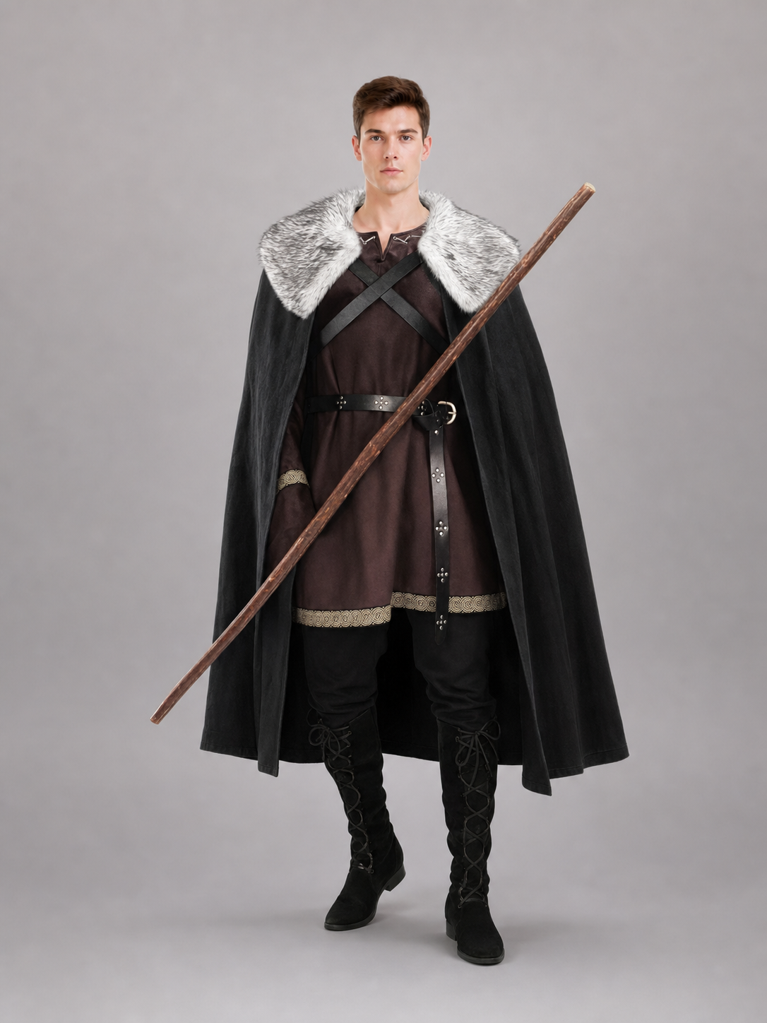 Man wearing the long black medieval cape with a gray faux fur collar over a brown tunic, front view (staff not included)