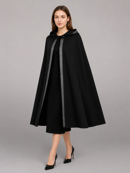 Black hooded cloak with silver patterned trim, shown from a front three-quarter angle on a model