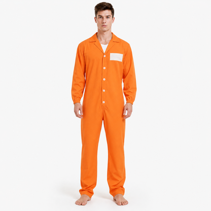 Full-body model in an orange button-front jumpsuit with long sleeves, pointed collar, white chest patch, and bare feet