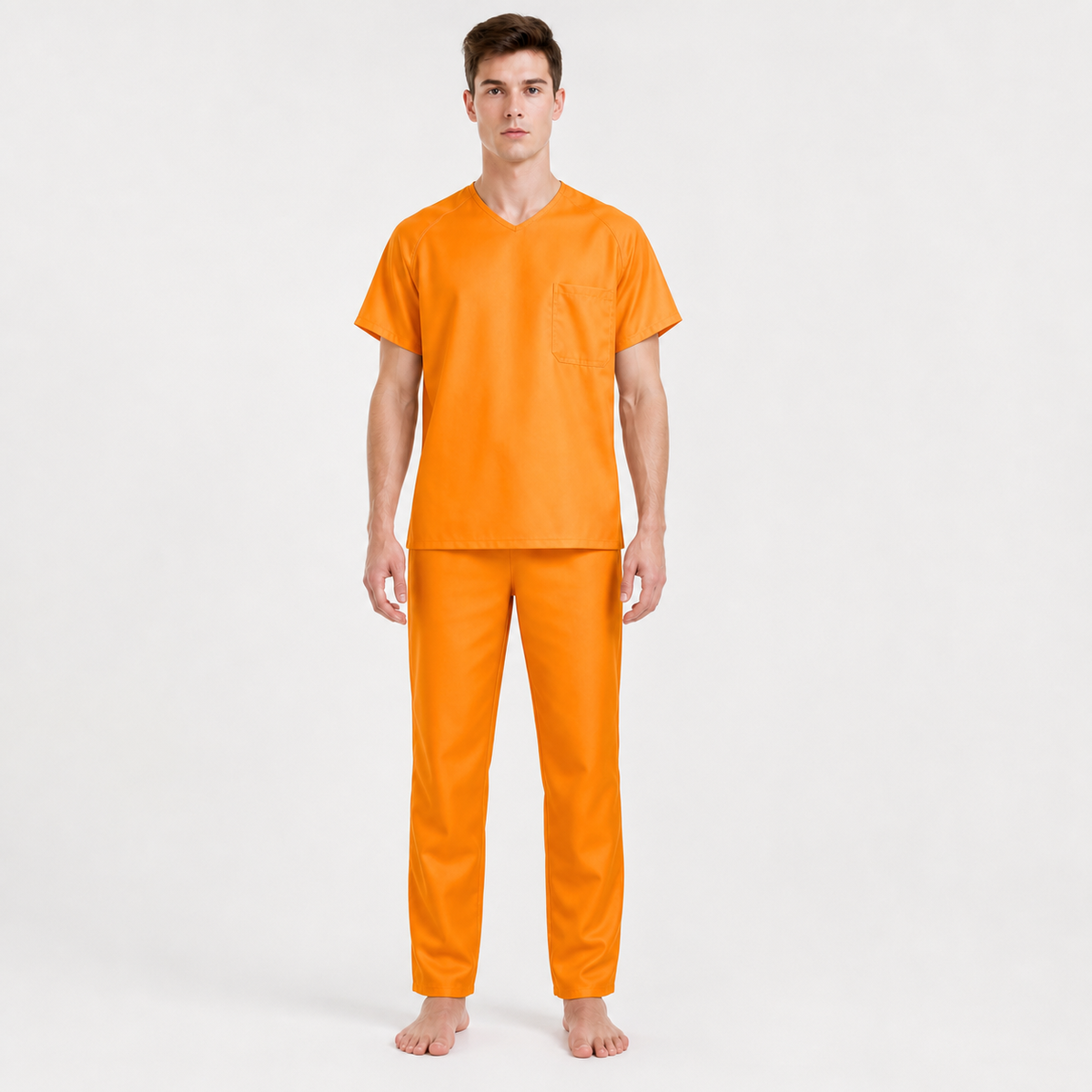 Orange two-piece costume set shown full-body on a model, with a short-sleeve shirt, chest pocket, and straight-leg pants