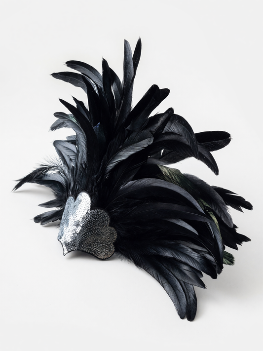 Feather carnival accessory with a silver heart