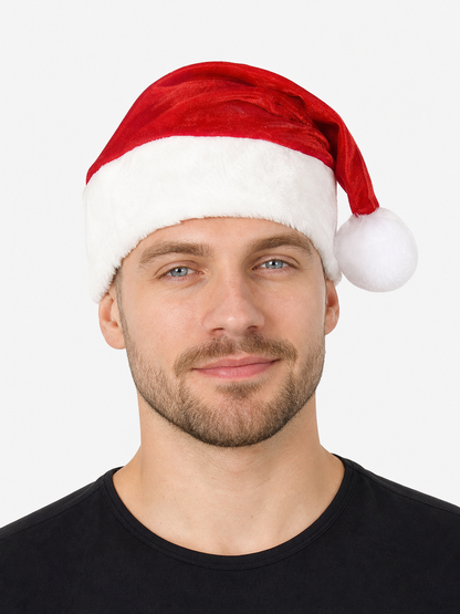 Close-up of a red velvet hat with a wide white plush brim and white pom-pom on a model