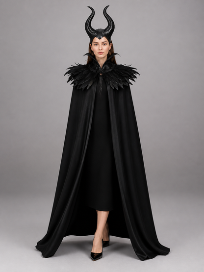 Black costume cape shown front-facing on a model, featuring a floor-length drape, tall curved horns, and a layered feather collar
