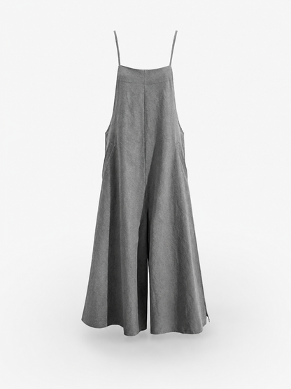 Gray wide-leg overalls hanging against a white background, with thin shoulder straps, a bib front, and flowing pant legs