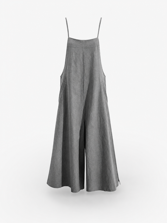 Gray wide-leg overalls hanging against a white background, with thin shoulder straps, a bib front, and flowing pant legs