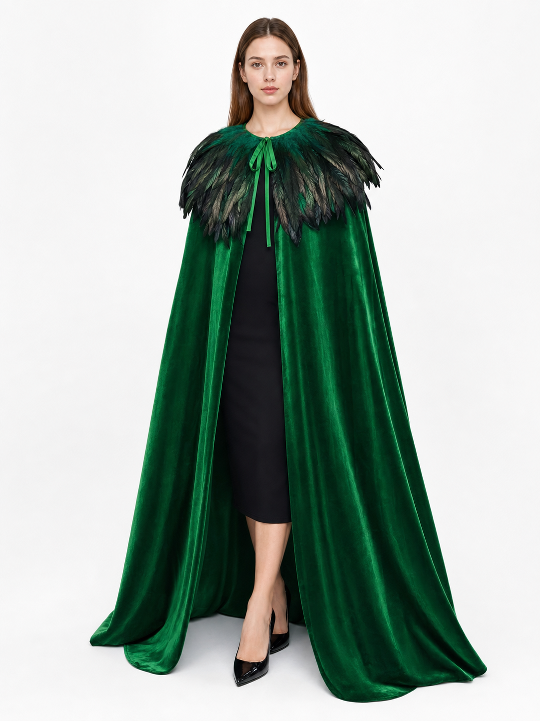 Full-length green velvet cape on a model, featuring a layered black and green feather collar and front tie