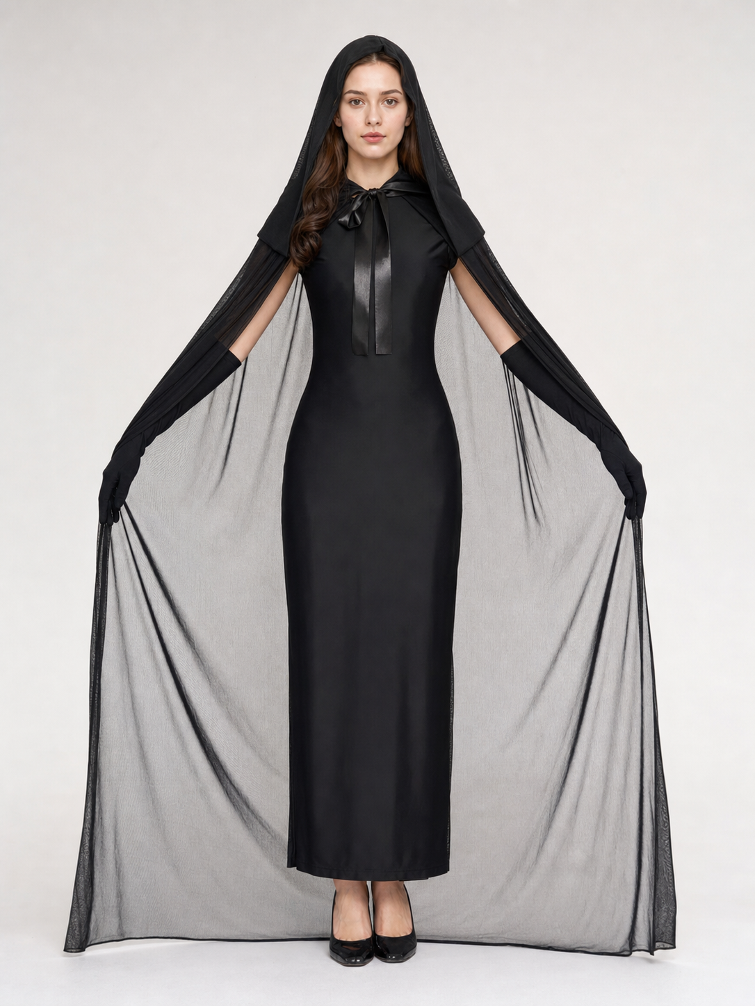 Black hooded cape with sheer mesh panels draped from the arms, shown full-body on a front-facing model