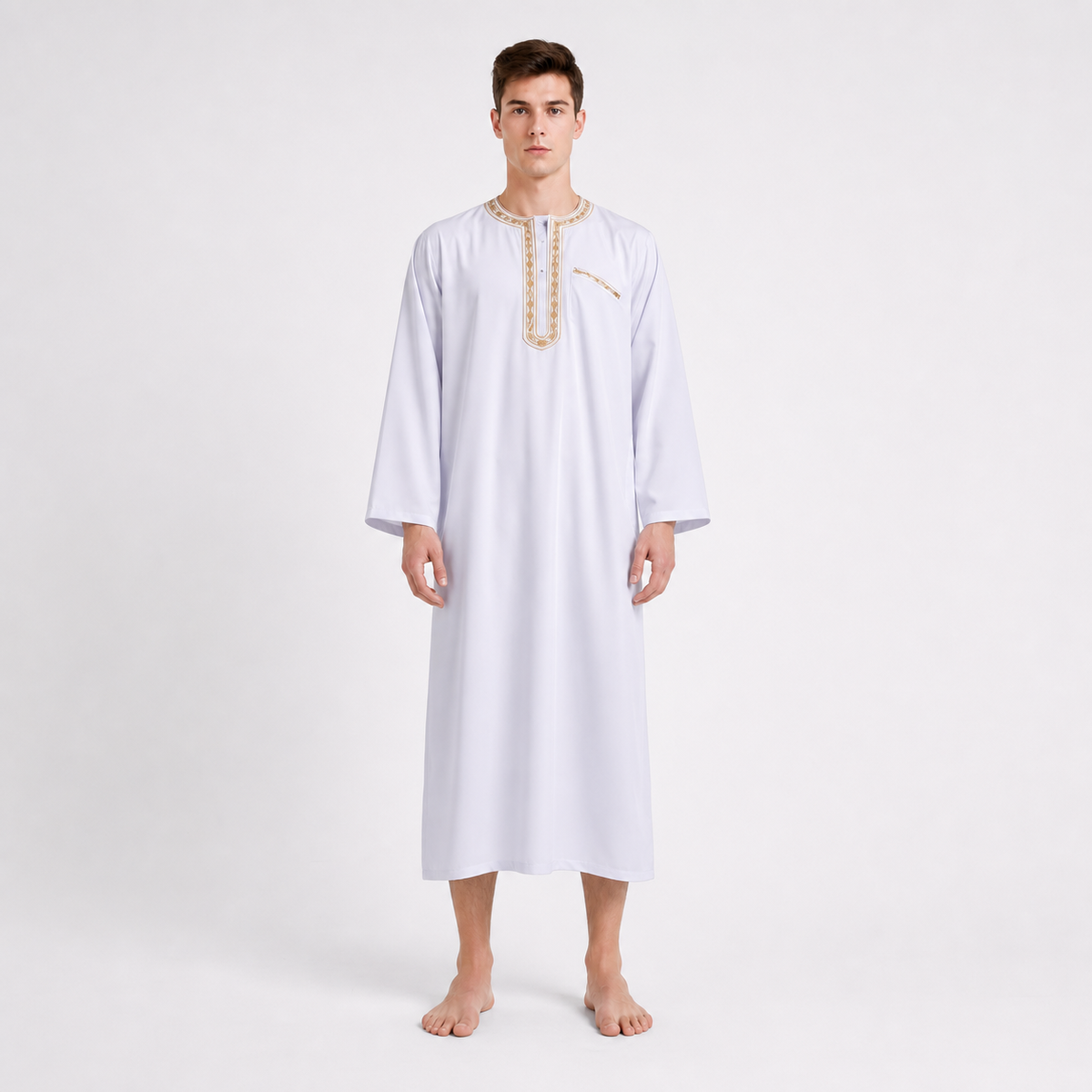 White ankle-length robe with gold-toned neckline and chest trim, shown from the front on a barefoot model
