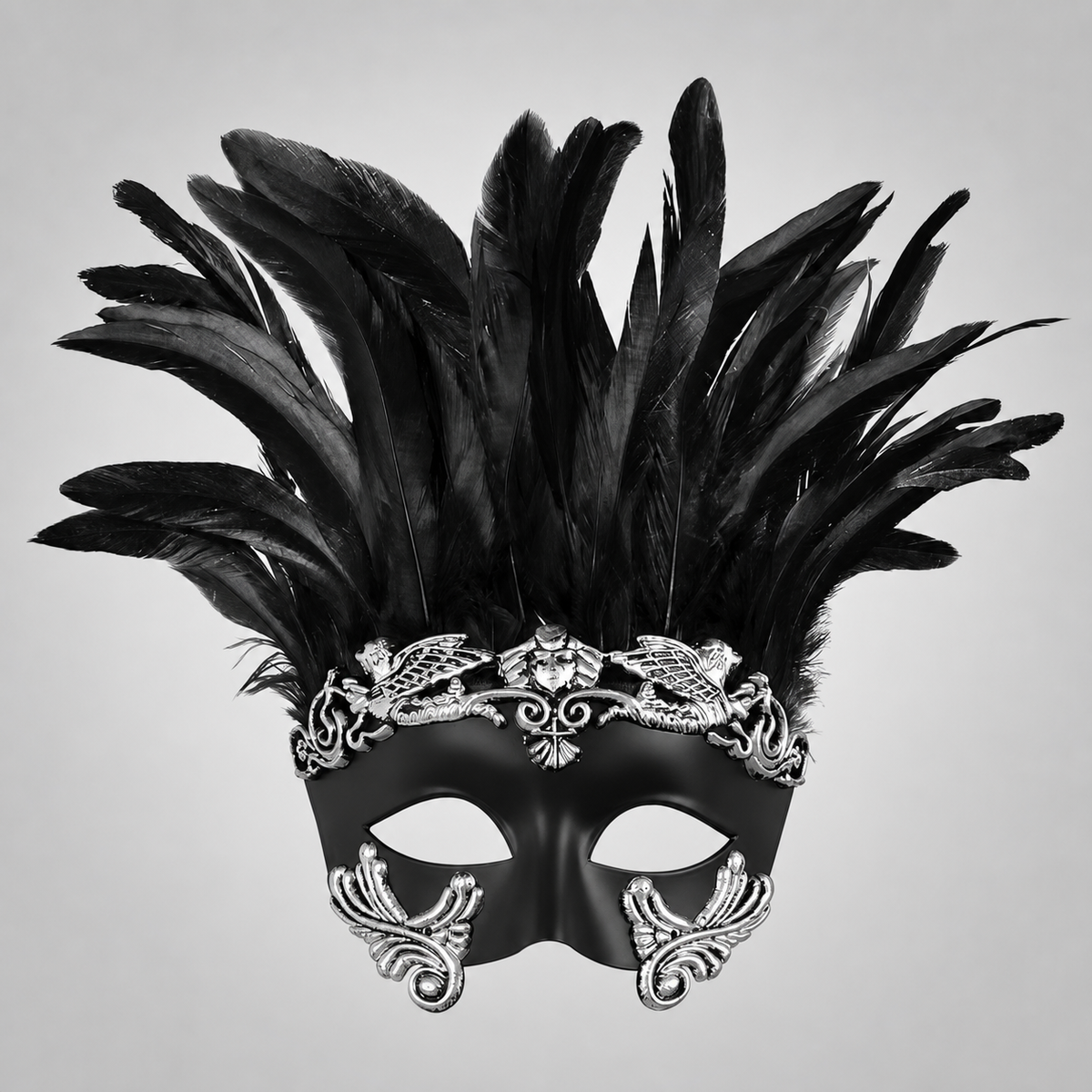Black half-face masquerade mask with tall feathers and silver scrollwork shown front-facing against a gray background