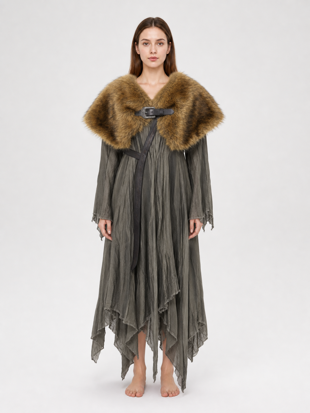 Brown fur-textured shoulder cape worn over a long gray dress, shown full-body with a black front buckle