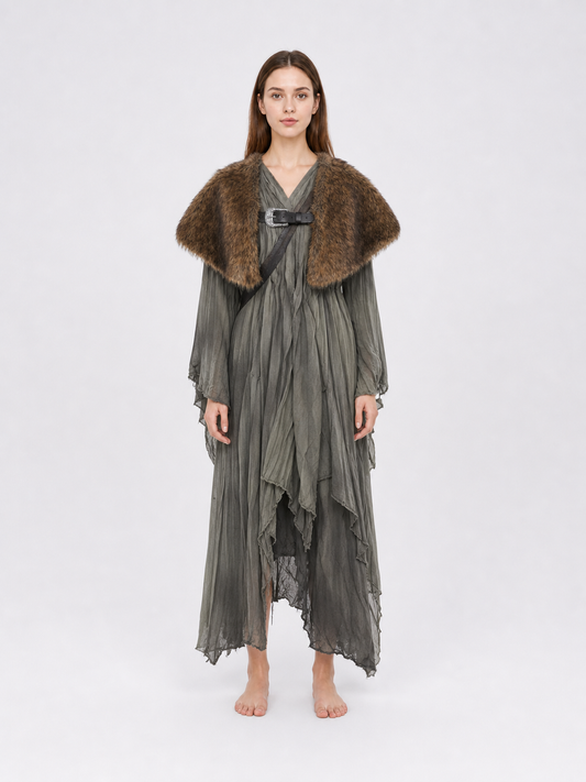 Brown fur-like shoulder cape with a front buckle, shown full-body over a long gray dress on a model