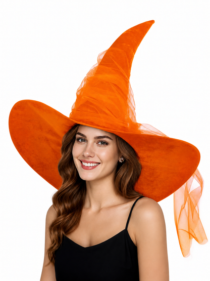 Orange witch hat shown on a smiling woman, with a tall pointed crown, wide brim, and sheer mesh hanging at the side