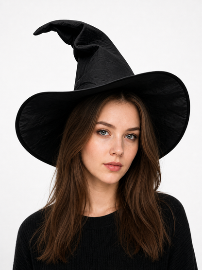 Black fabric witch hat with a wide brim and bent pointed crown, shown in a close-up portrait on a brunette model
