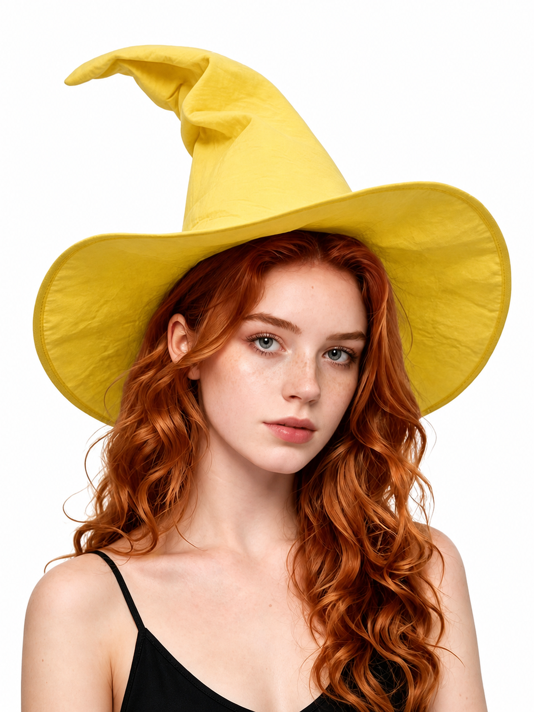 Yellow pointed witch hat with a floppy crown and wide brim, shown in a close portrait of a red-haired model