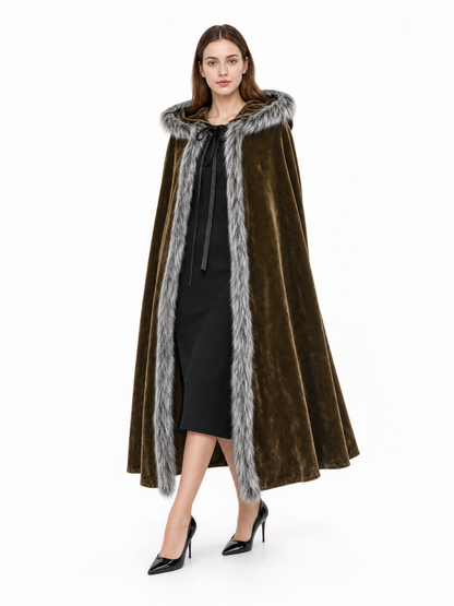 Brown velvet-look cape with fur-trimmed hood and front edges, shown full-length on a model against a white background