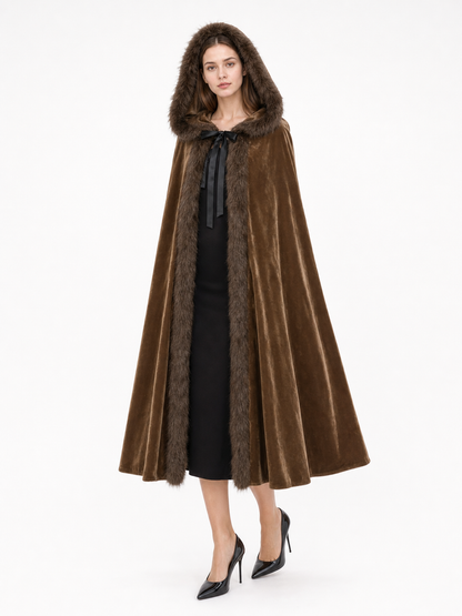 Brown velvet-look hooded cape with fur trim and black ribbon tie, shown front-facing on a model