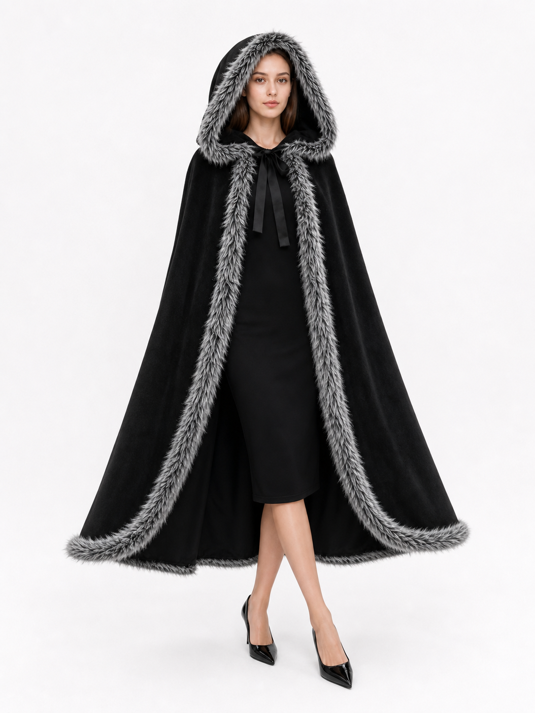 Black hooded cape with gray trim shown full-length on a model, worn open over a black dress