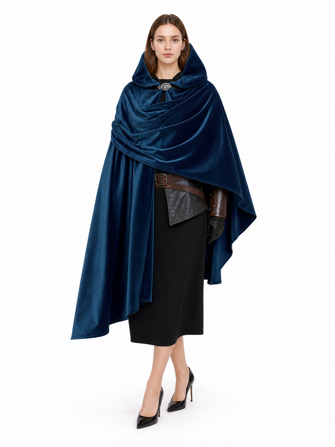 Dark blue velvet-look hooded cloak shown full-length on a model over a black outfit, with a decorative neck clasp