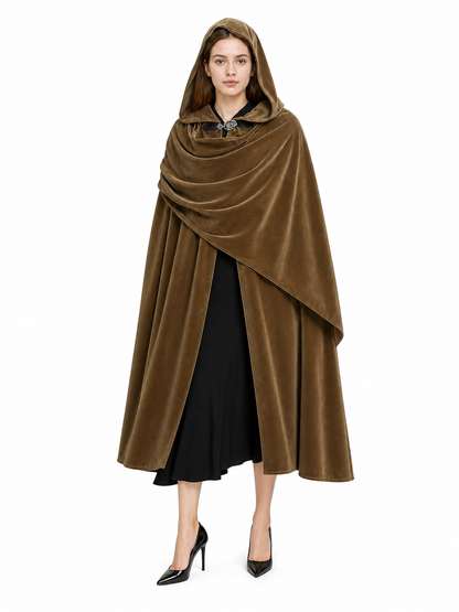 Brown velvet-look hooded cloak shown full-length on a model against a white background, with layered front draping and clasp