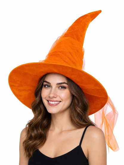 Orange witch hat modeled on a woman, showing the tall curved crown, wide brim and sheer veil against a white background