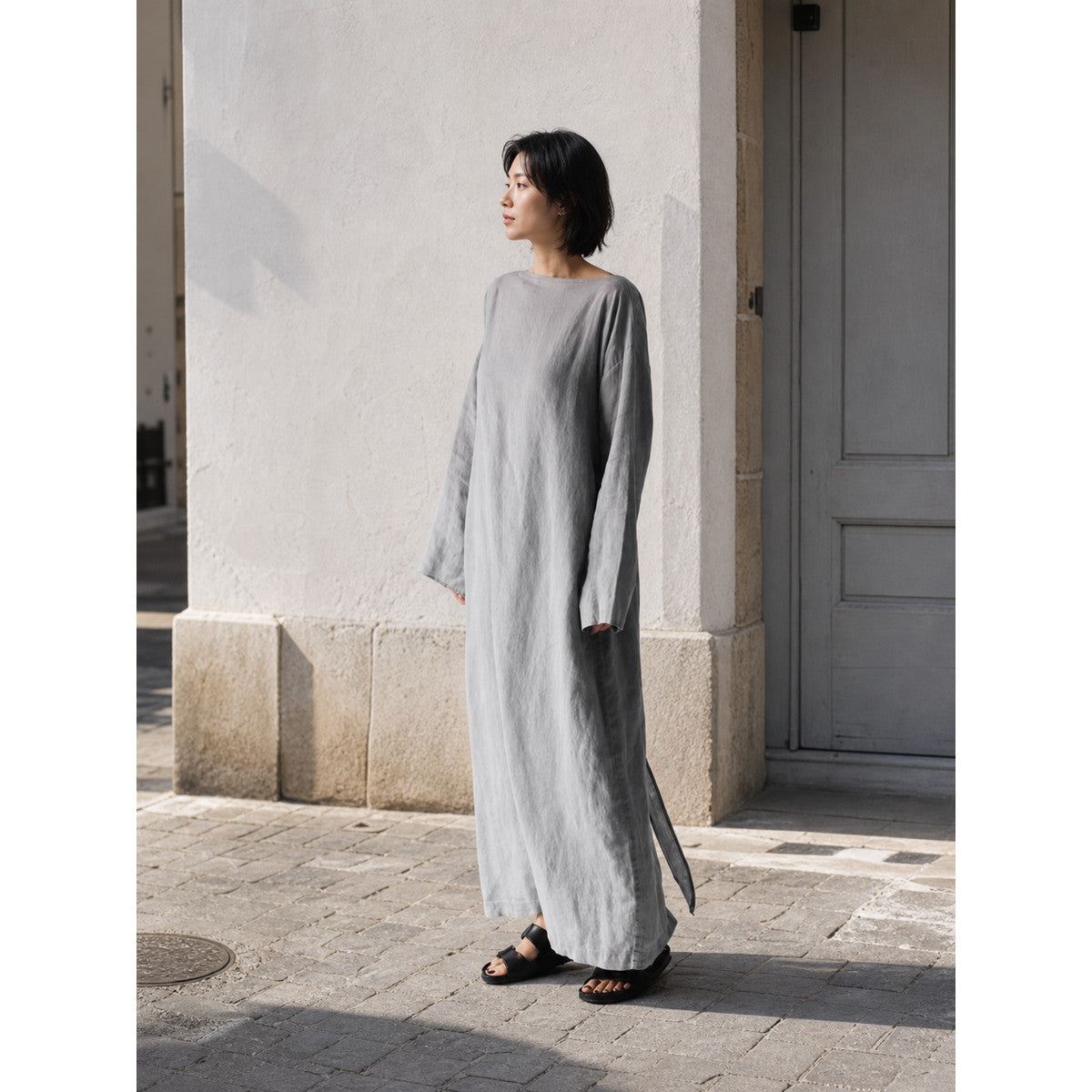 Gray long dress with long sleeves and a slit