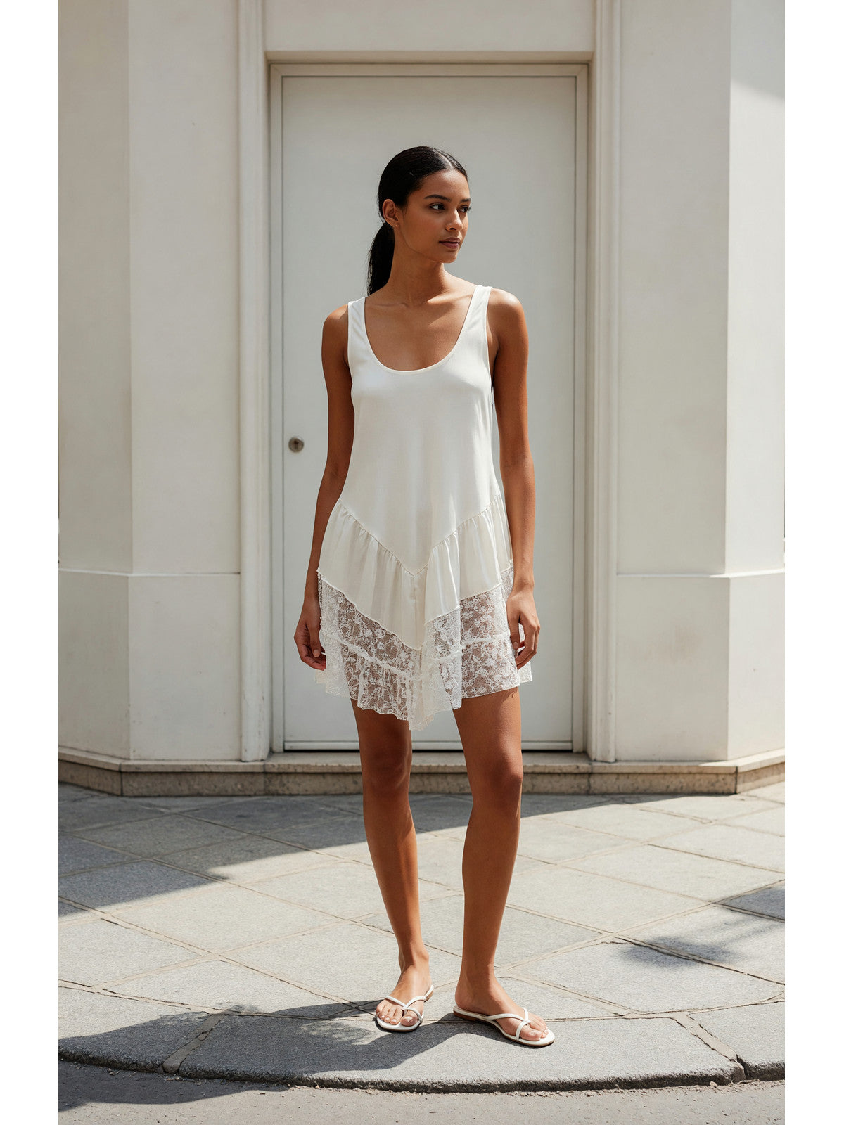 Sleeveless Top with Ruffles and an Asymmetrical Hem