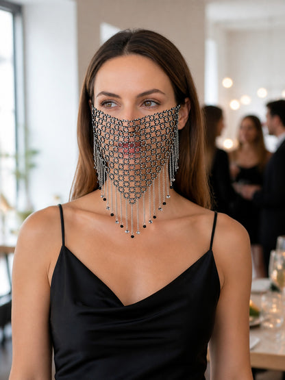 Front close-up of a black and silver chain mesh mask with layered dangling chains and small dark bead accents