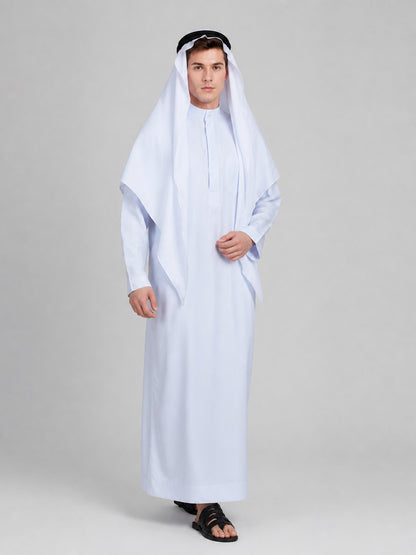 White full-length robe with long sleeves, draped head covering, and black headband, shown on a model in a three-quarter studio view