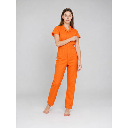 Orange short-sleeve jumpsuit shown on a standing model, featuring a collared neckline, front closure, fitted waist, and straight legs