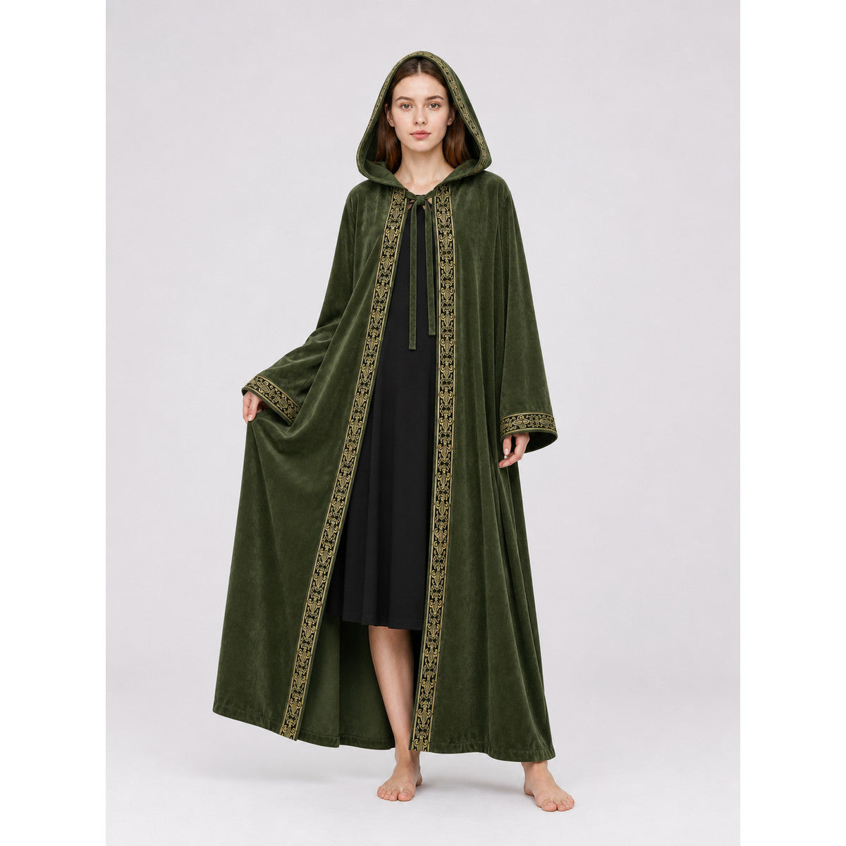 Green velvety hooded cloak shown full length on a model, with gold trim, wide sleeves, and a black dress underneath