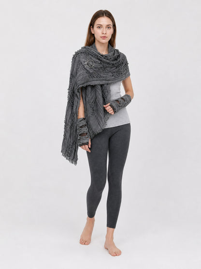 Gray hooded scarf with fingerless gloves, layered distressed fabric and long fringed ends, shown on a barefoot model