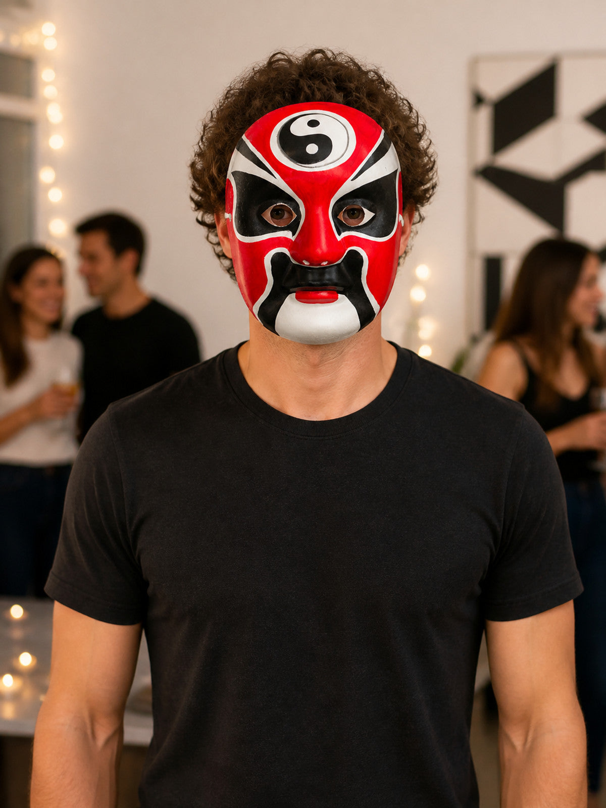 Carnival mask with a red, black, and white face for Halloween