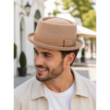 Caramel-colored fedora hat suitable for everyday outfits, outdoor walks, themed events, and costume styling. The design features a classic fedora silhouette: a structured crown with a rounded top, a distinctive front indentation, and a wide