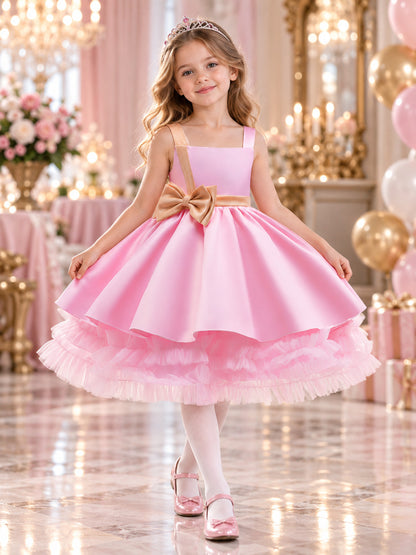Pink girls' party dress with bow and puffy skirt