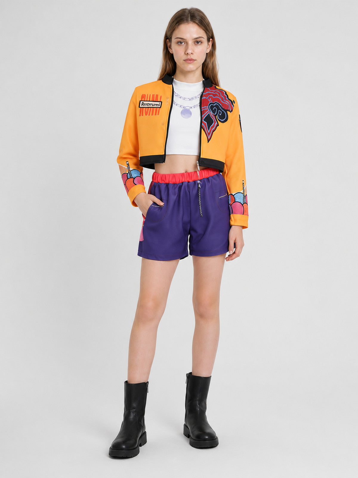 Children's set with an orange jacket and purple shorts