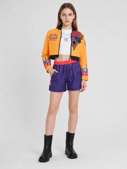 Children's set with an orange jacket and purple shorts