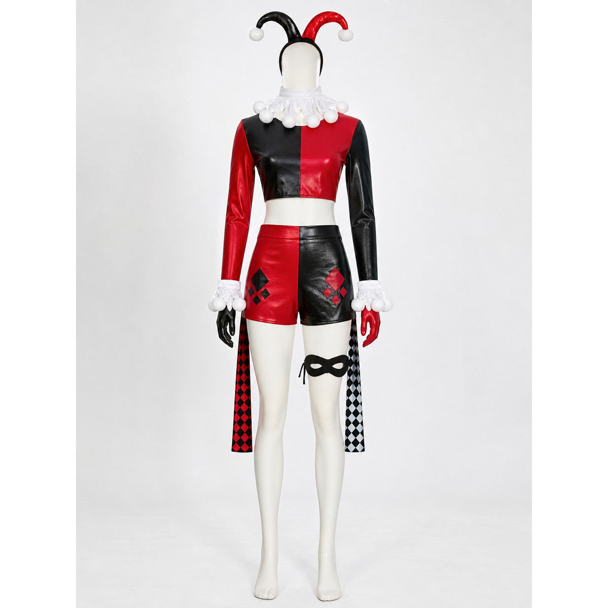 Black and red harlequin clown costume set on a mannequin with jester headband, pom-pom collar, gloves, eye mask and diamond stockings