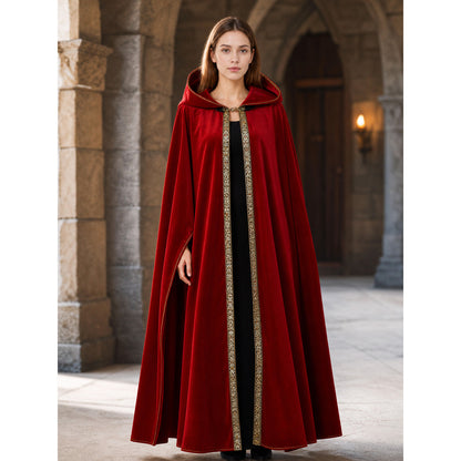 Red hooded cloak shown full-body on a model in a stone archway, with a flowing open front and patterned vertical trim
