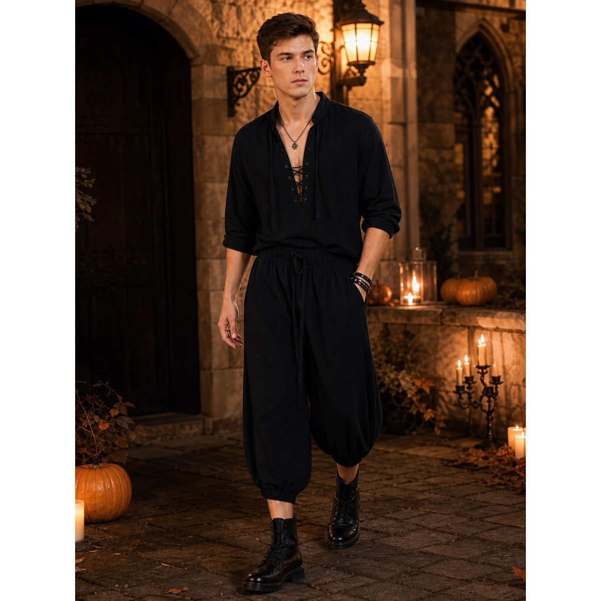Black cropped pants with gathered elastic cuffs, styled on a full-body model wearing boots outdoors