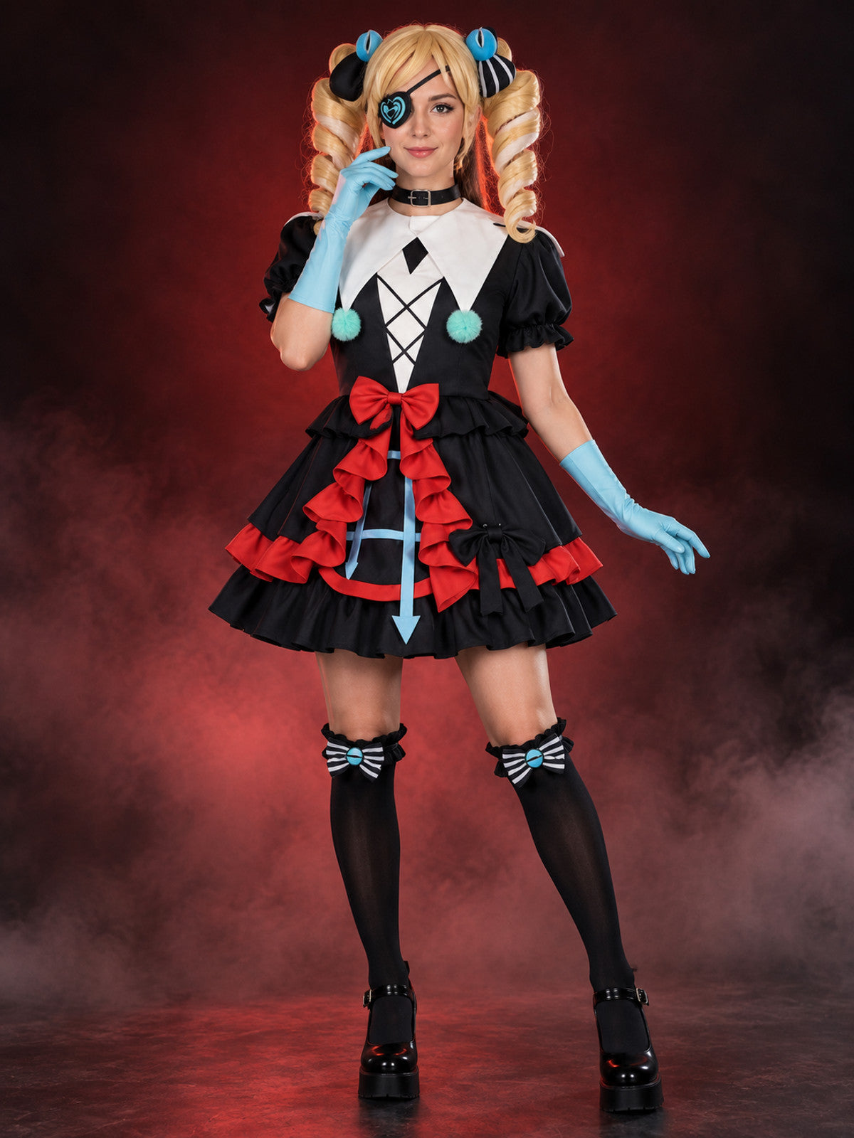Cosplay costume with a white cape, black dress, and bows
