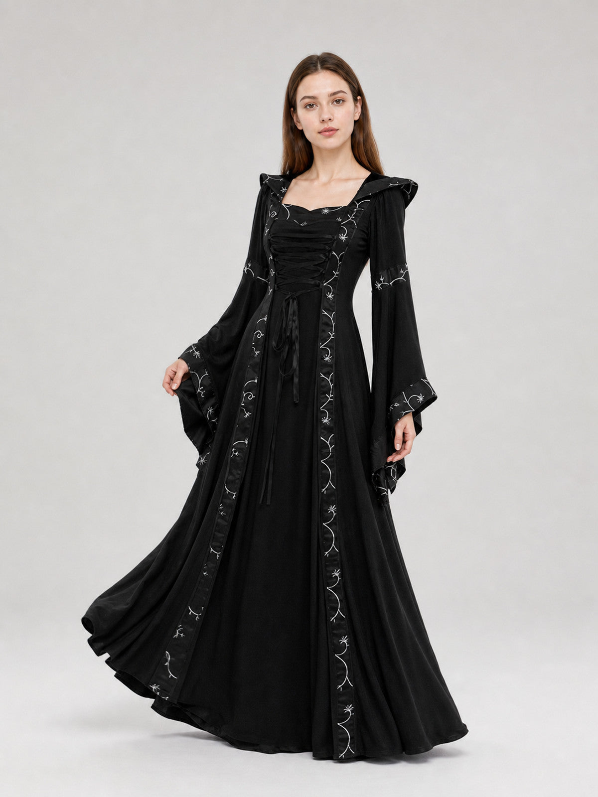 The dress is designed in a Gothic style with elements of Victorian aesthetics.