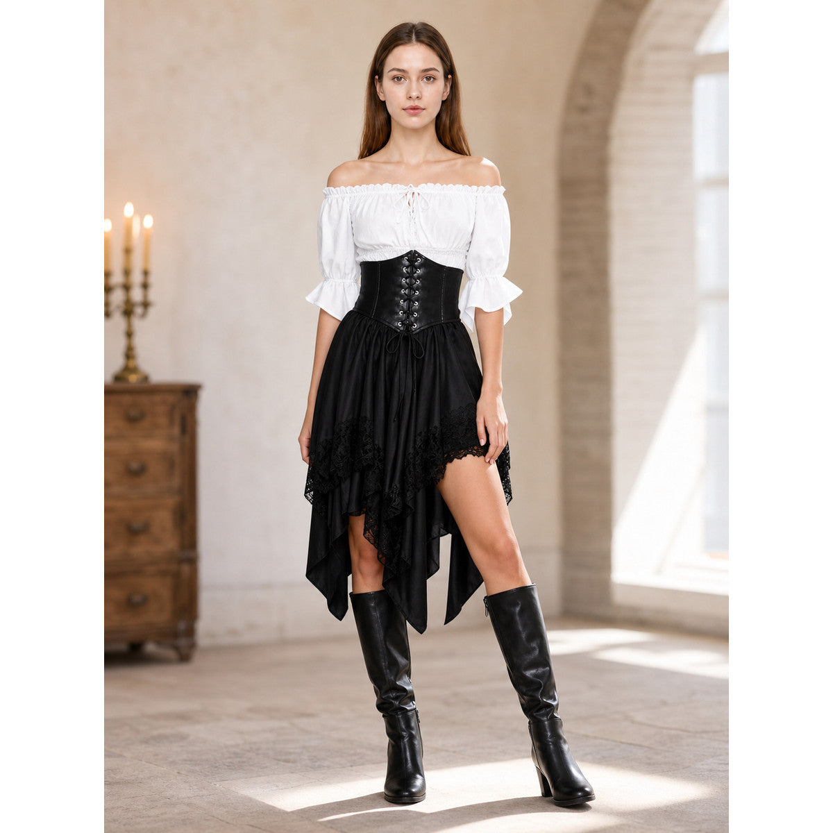 The set is designed in a theatrical pirate style and consists of a white cropped off-the-shoulder top with voluminous puff sleeves, a black corset with front lacing and metal eyelets, and a black asymmetrical skirt with elongated pointed pa