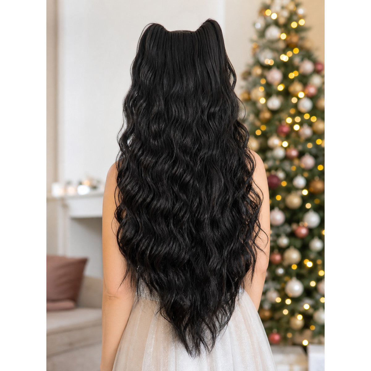 Costume beard in long black wavy fibers, shown from the back on a person in front of a decorated tree